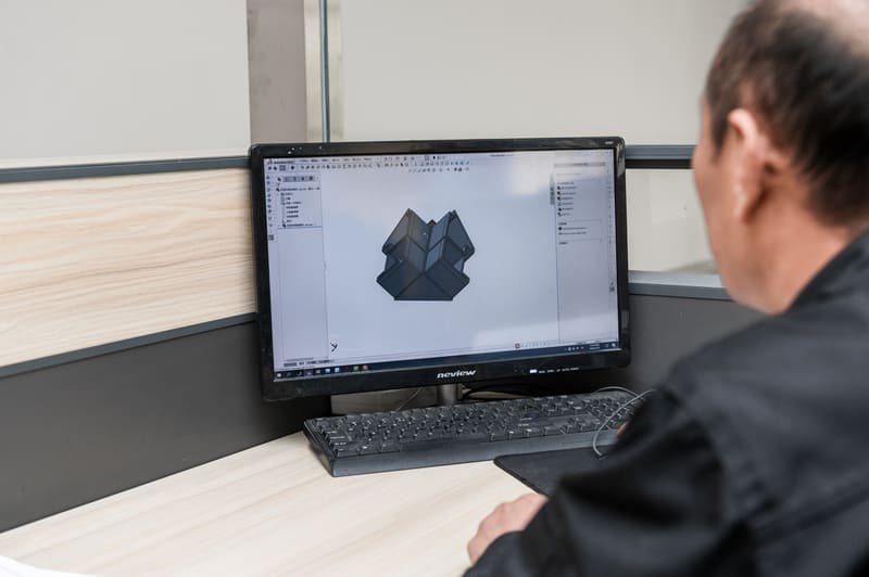 Engineer reviewing 3D model for investment casting wall thickness investment casting wall thickness analysis