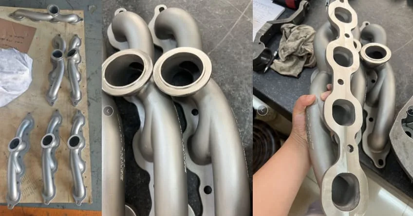 Multiple views of 304 stainless turbo manifolds showing integrated passages and finished flange interfaces