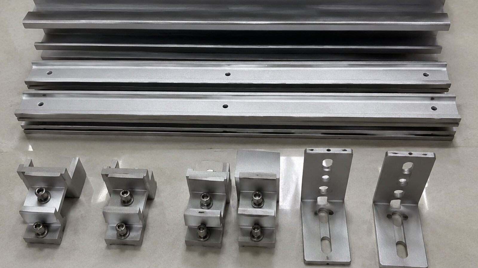 A380 aluminum die-cast solar mounting hardware components arranged as a set