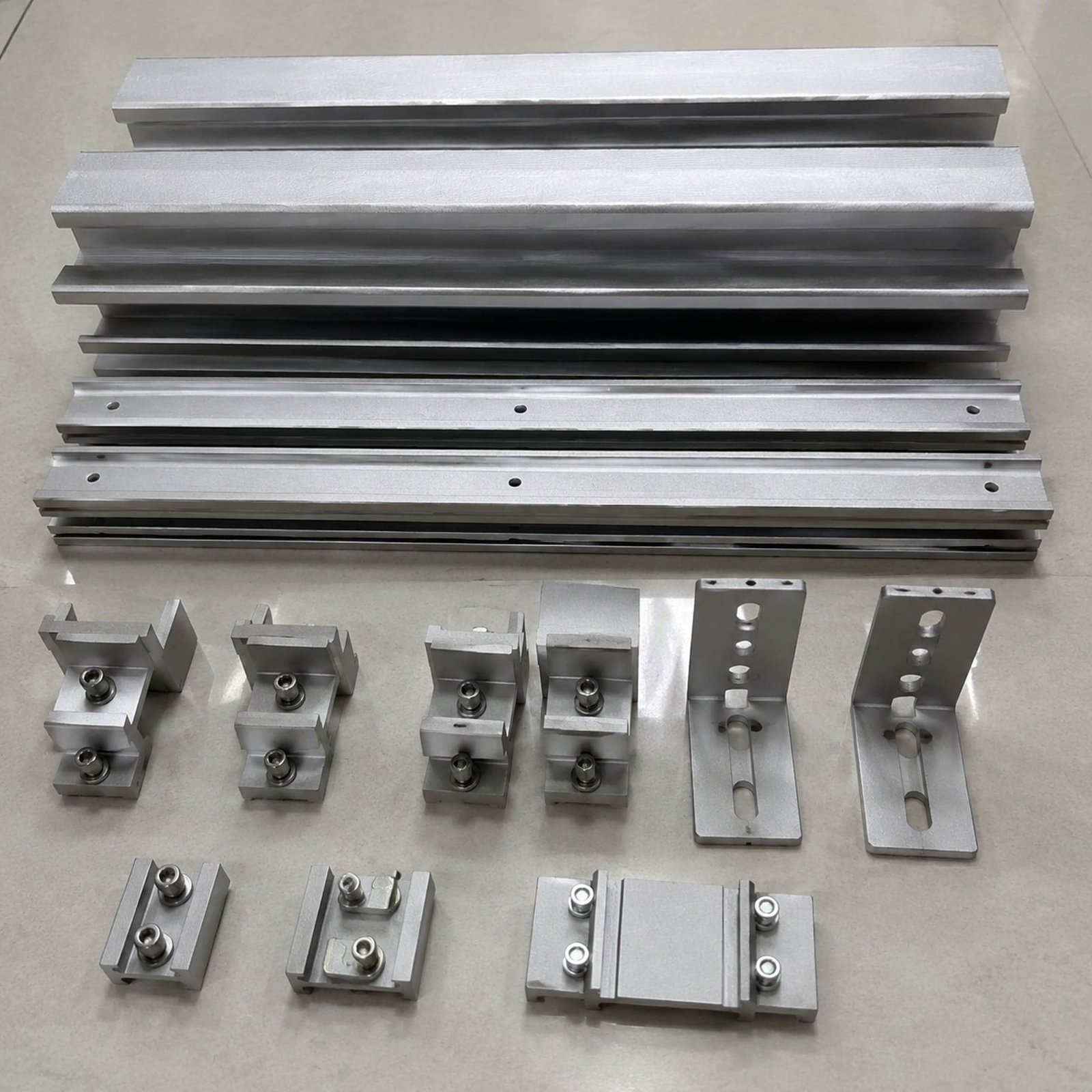 A380 aluminum die-cast solar mounting hardware components arranged as a set