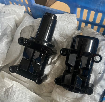 Pair of black powder-coated A380 die-cast mounting components