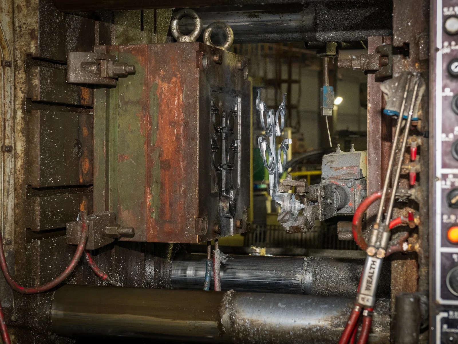 Steel die tooling mounted inside a die casting machine