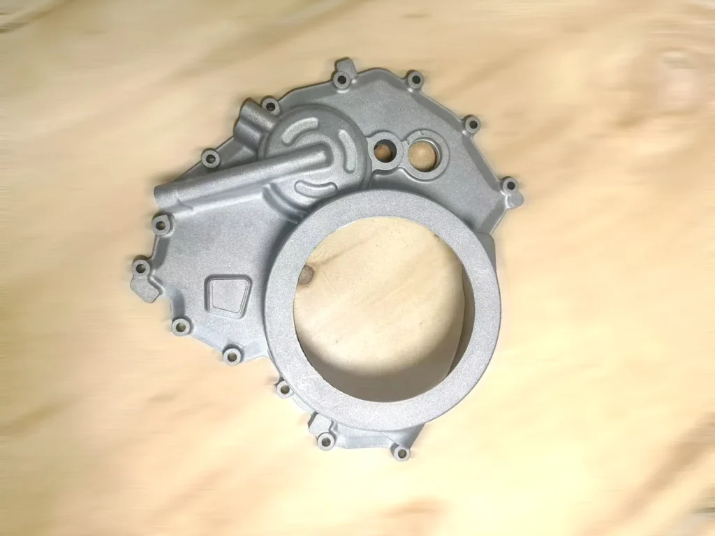 Finished aluminum die cast housing with ribs and machined openings