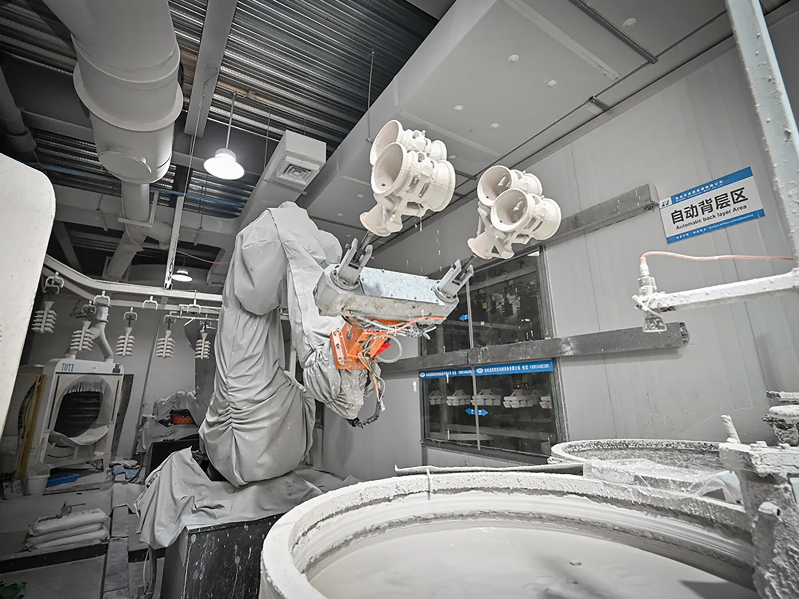 Automated ceramic shell coating for investment casting trees