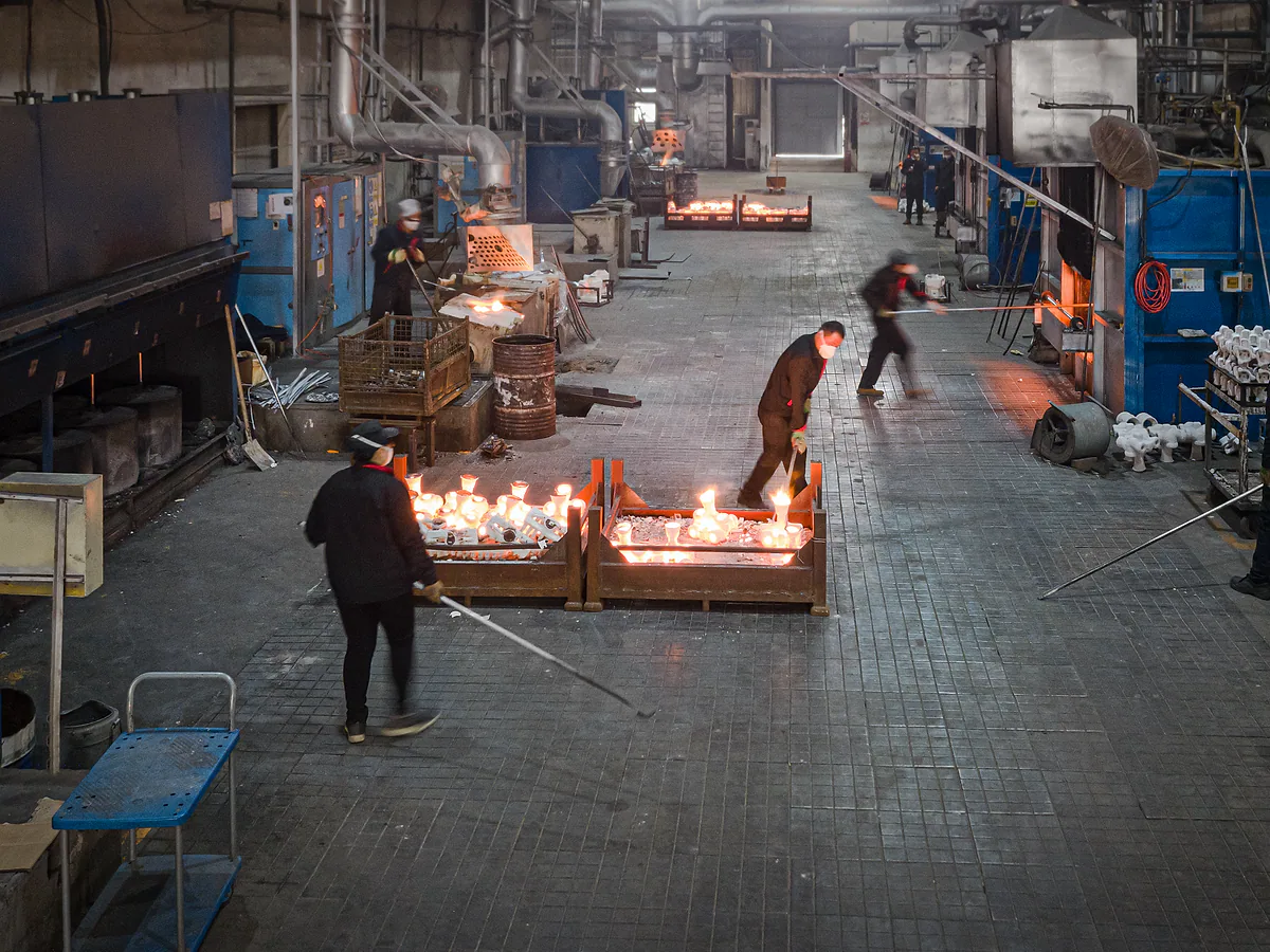 Investment casting workshop during molten metal pouring