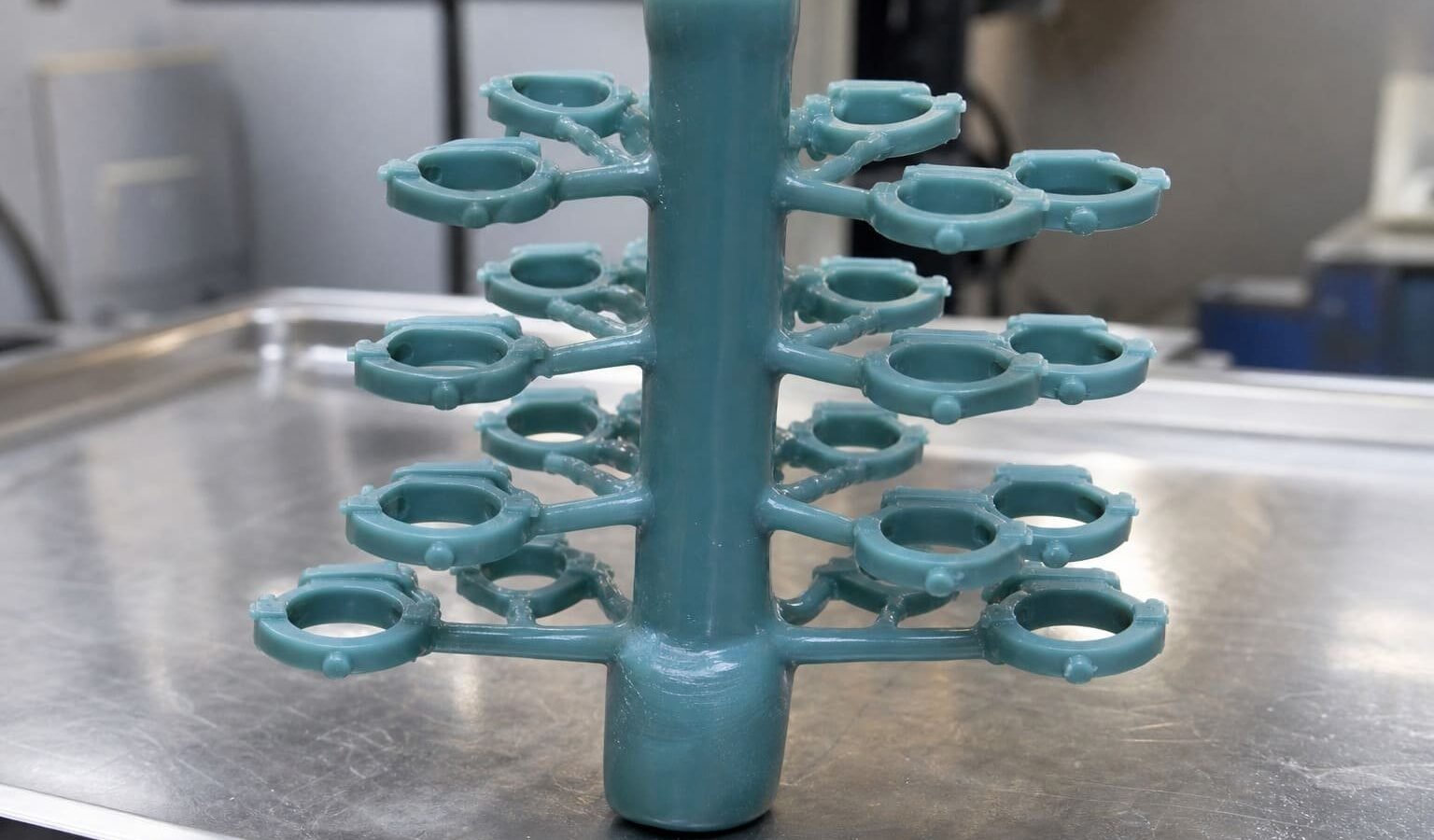 Wax patterns assembled around a central sprue for investment casting