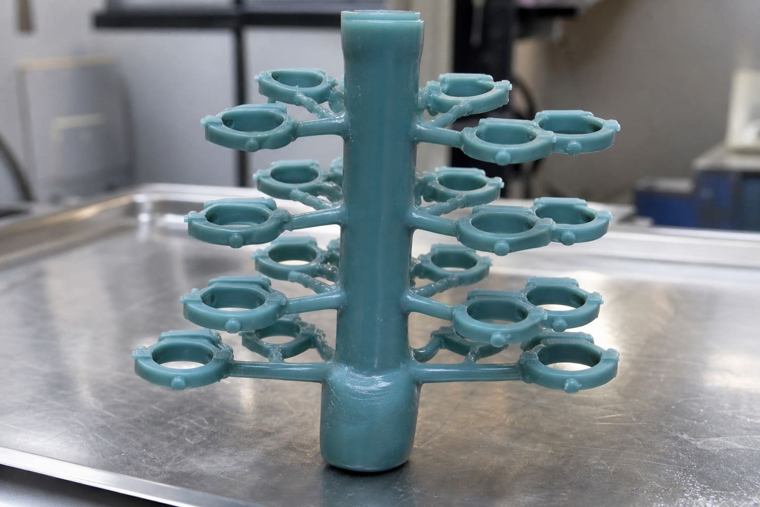 A tree of wax patterns ready for the investment casting shell building process