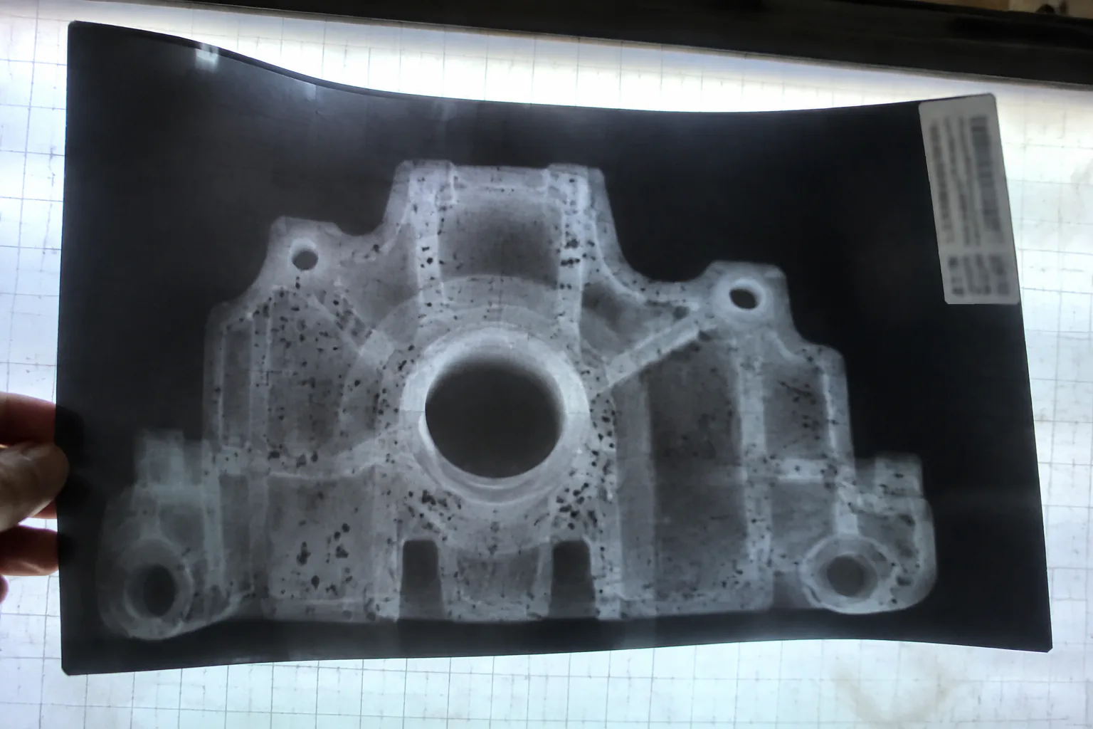Close-up X-ray image showing gas porosity within a metal casting
